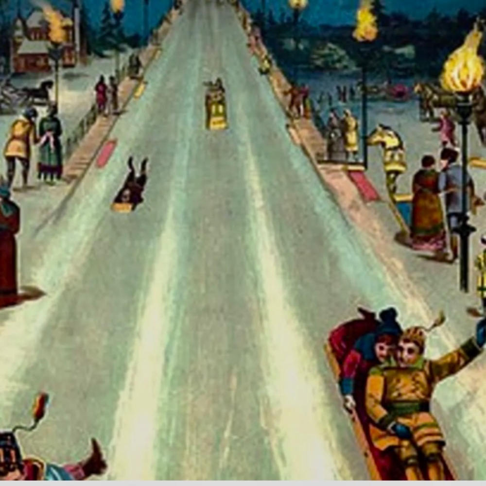 Tobogganing at night with torches lit